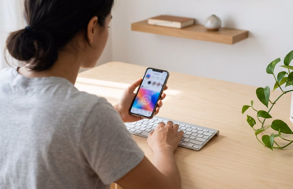Mobile phone displaying LinkedIn post with image upload