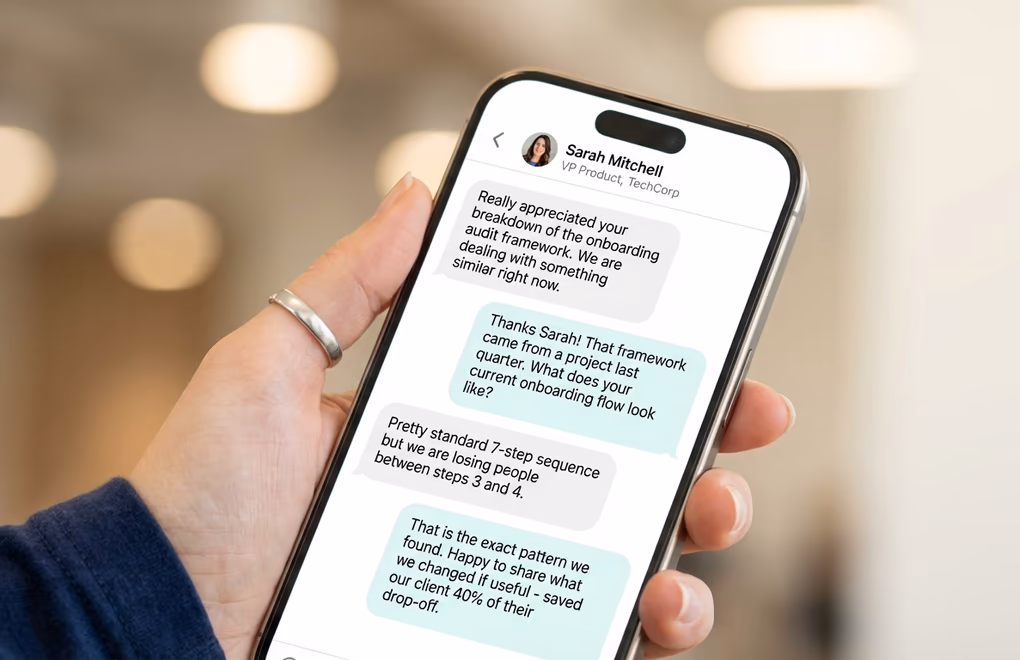 A phone a LinkedIn DM conversation between two professionals with natural back-and-forth messages that feel like a